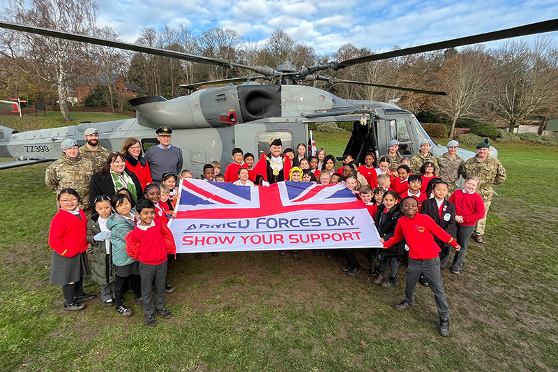 Celebrating In Front Of The Helicopter With The Armed Forces Day Flag